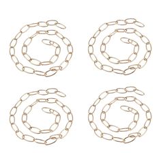 four pieces of gold chain on a white background