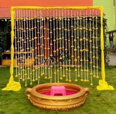 a decorated lawn area with yellow and pink decorations