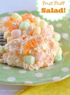 a green plate topped with fruit fluff salad