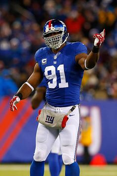 a football player with his hand in the air