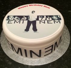 a birthday cake with an image of emii nem on the front and sides