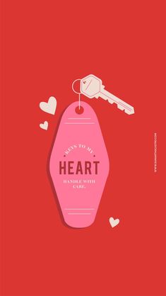 a pink heart shaped tag with a key hanging from it's end on a red background