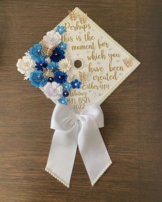 a graduation cap decorated with flowers and ribbons