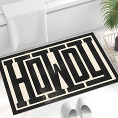 a black and white door mat with the word hod on it in large letters