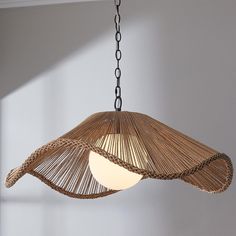 a light hanging from a ceiling in a room