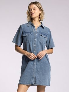 Style Description: FINAL SALE Designed a classic point collar, short sleeves, and snaps along the front, this denim mini shirtdress has dual side and patch pockets. Dress it up with boots or go casual in your favorite sneakers. Collared neckline Button front closure Multiple pockets Measurements for a size small: Length: 35.5" Chest: 20" Sweep: 21.5" Fabric Content/Care: 100% Cotton Machine Wash ColdImport Cotton Button-up Denim Dress With Pockets, Button-up Cotton Denim Dress With Pockets, Button-up Denim Dress With Pockets, Cotton Short Sleeve Shirt Dress With Buttoned Pockets, Cotton Short Sleeve Shirt Dress With Pockets, Short Sleeve Shirt Dress With Pockets For Fall, Cotton Short Sleeve Shirt Dress For Fall, Fall Cotton Shirt Dress With Short Sleeves, Casual Short Sleeve Shirt Dress With Buttoned Pockets