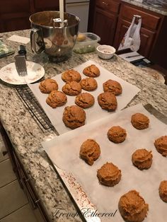 some cookies are sitting on top of the cookie sheet and ready to go into the oven