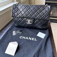 Selling Something Very Special To Me. Authentic Chanel Black Lambskin Purse Style Is Called Sac Class Rabat Comes With Dust Bag, Tissue Paper, Authenticity Card And Felt Fabric To Keep This Beauty In Mint Condition. See Measurements For Size. This Is Not A Common Purse It Is Large And I Honestly Don’t See This On Anyone. Comes In Original Chanel Black Box. Inside Is Superbly Clean. Has Zipper Pocket And An Additional Pocket. Outside Is Also In Good Condition With Small Outer Pocket. The Purse Has Had Some Touch Ups Included Reinforced Stitching On The Left Side Cupped Inside And Leather Chain Has Been Reinforced Once Before. This Purse Overall Is In Great Condition. I Would Give It An Purse Style, Purse Styles, Felt Fabric, Chanel Black, Black Box, Leather Chain, Silver Hardware, Tissue Paper, Mint Condition