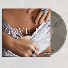 a woman's stomach with the words love and lady wood on it, in front of an album cover