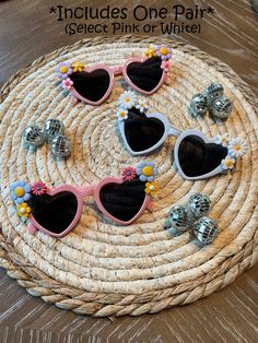 "Fun heart-shaped sunglasses with flowers in the corners are perfect for any bachelorette Party, Birthday Party, or any day out! These are handmade in two color options white or pink. *Note that sunglasses will have different combinations of flowers on each pair of sunglasses.  IMPORTANT:  One pair of sunglasses is included, Buy 5 or more and save 10% with coupon code \"PARTY10\"" Fun Party Sunglasses With Heart Print, Fun Heart Print Party Sunglasses, Cute Party Sunglasses With Heart Print, Heart-shaped Sunglasses With Heart Print For Party, Cute Heart Shaped Sunglasses For Beach, Cute Heart Print Sunglasses For Party, Playful Party Sunglasses For Spring, Heart-shaped Party Sunglasses With Heart Print, Fun Spring Festival Sunglasses