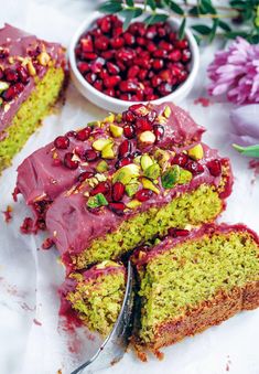 a close up of a cake with cranberry frosting