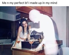 a woman standing in front of a counter with wine glasses on it and the caption reads, me my perfect b i made up in my mind