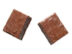 two pieces of chocolate sitting on top of each other