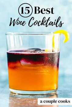 a glass filled with liquid and lemon on top of a table next to the words, 15 best wine cocktails