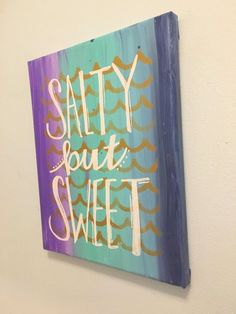 a painting on the wall that says salty but sweet with gold and purple waves in it