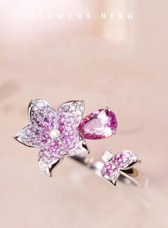 •Condition: Brand new•Center Stone: Natural Pink Sapphire, Pear Cut, approx 0.92ct•Side stones: Natural White Diamond round-cut (VS1 clarity and F color)Natural White Sapphire, Marquise cut•Ring Weight: 2.65ct•Ring Dimension: 19.8x19mm•Metal Purity: Optional Each piece is made-to-order with care and special attention to detail. all items are made with conflict-free diamonds and gems.Size: made to orderThe item will be gift wrapped and shipped.----------------------------------------------------- Elegant Multi-stone Pink Sapphire Diamond Ring, Elegant Multi-stone Diamond Flower Ring, Elegant Multi-stone Diamond Ring With Pink Sapphire, Fine Jewelry Sapphire Flower, Sapphire Flower Jewelry In Fine Style, Diamond Multi-stone Flower Ring, Flower Shaped Diamond Ring With Multi-stones, Formal Pink Flower-shaped Rings, Fine Jewelry White Gold Gemstone Flower Ring