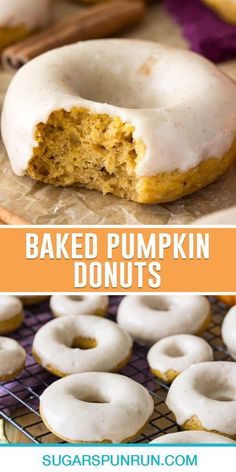 baked pumpkin donuts with white frosting and cinnamon sprinkles on a cooling rack