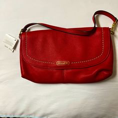 Beautiful And Soft Leather Coach Wristlet Red Travel Clutch With Adjustable Strap, Red Clutch With Adjustable Strap For Travel, Red Coach Clutch Bag, Red Pouch Clutch With Adjustable Strap, Red Handheld Clutch With Removable Pouch, Red Clutch With Adjustable Strap For Daily Use, Coach Red Clutch With Removable Pouch, Red Coach Clutch As A Gift, Red Coach Clutch For Gift