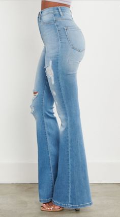 Elevate your denim collection with the Lara Distressed Flare Jeans, crafted from stretch denim for ultimate comfort and flexibility. Featuring a high-rise fit that accentuates your figure and a super soft fabric that's gentle on the skin, these jeans offer both style and comfort for all-day wear. With their full-length flare design, they effortlessly combine trendiness with versatility, perfect for any occasion. Fabric Content: 51% Cotton 35.4% Modal 6.4% T400 Lycra 1.1% Stretch Jeans With Frayed Hem In Dark Wash, Stretch Dark Wash Jeans With Frayed Hem, Stretch Light Wash Jeans With Frayed Hem, Stretch Ripped Straight Leg Pants, Ripped High Rise Flare Jeans In Dark Wash, Light Wash Distressed Jeans For Fall, Stretch Mid-rise Denim Jeans, Flare Distressed Denim Blue Jeans, Flare Distressed Denim Jeans