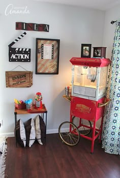 a living room filled with furniture and pictures on the wall