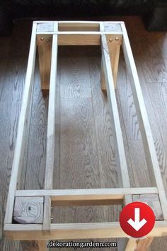 a wooden table sitting on top of a hard wood floor