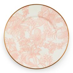 an orange and white plate with pink flowers on the rim, against a white background