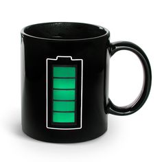 a black mug with a green battery on it