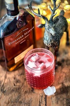 a reindeer head is next to a glass with ice