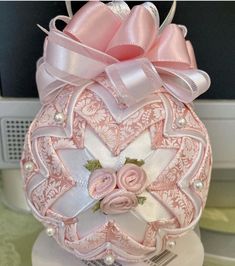 a pink and white decorative object on top of a table