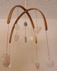 a wind chime with glass beads hanging from it