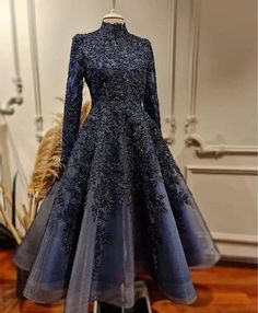 Elevate your evening look with this exquisite navy blue lace evening dress. The intricately detailed lace overlay exudes elegance and sophistication, ensuring you stand out at any formal event. The high neckline and long sleeves add a touch of modesty, perfectly balancing the bold, intricate design that envelops the entire dress.Crafted for the discerning fashionista, this dress features a flattering A-line silhouette that accentuates your waist and flows gracefully down. The high-quality fabric Hijab Lehenga, Muslim Prom Dress, Reception Gowns, Lace Evening Dress, Soiree Dress, Classy Lady, Anarkali Kurta, Evening Dresses Plus Size, Lace Blue Dress