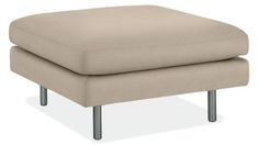 a beige footstool with metal legs on an isolated white background for use in furniture design