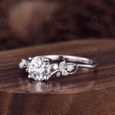 a diamond ring on top of a wooden table