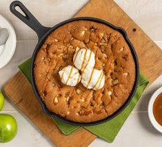 an apple cobbler with ice cream and caramel drizzled on top