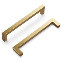 two brass handles on white background