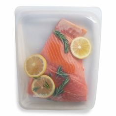 fresh salmon with lemons and rosemary on the side