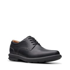 The timeless silhouette of the Clarks Rendell Plain Oxford will make a stylish addition to your closet. This versatile oxford is fitted with OrthoLite footbed that not only keeps moisture at bay but also provides superior cushioning and breathability. Part of the Clarks Collection. Classic Black Dress Shoes With Ortholite Insole, Classic Fitted Synthetic Oxfords, Classic Oxfords With Rubber Sole And Synthetic Material, Classic Synthetic Dress Shoes With Plain Toe, Classic Synthetic Plain Toe Dress Shoes, Classic Synthetic Oxfords For Derby, Classic Black Dress Shoes With Cushioned Footbed, Classic Synthetic Oxfords With Cushioned Footbed, Classic Synthetic Dress Shoes