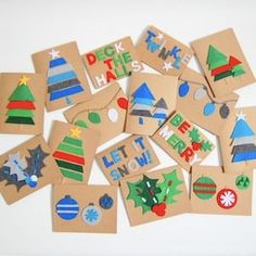 christmas themed cutouts are displayed on brown paper