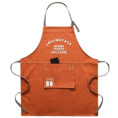 an orange apron with the words, smiling face on it's front and side pockets