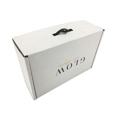 a white box with black handles and the word mot9 printed on it