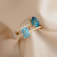 A baguette-cut swiss blue topaz gemstone paired with pavé set diamonds in the band for an extra sparkle.

This showstopper ring is a unique choice for an engagement ring or a gift for any special occasion. Set in 14k yellow gold.


Baguette-cut swiss blue topaz gemstone measures 7mm x 5mm 

Total gemstone carat weight: 1.41

18 round lab grown diamonds with a 2mm diameter  

Total diamond carat weight: 0.12

Diamond clarity: VS-SI

14k yellow gold band


 Size: 5, 6, 7, 8, 9