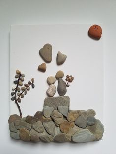 some rocks and plants on a white surface