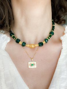 ROXANI NECKLACE Emerald green jade necklace with gold filled ethnic details Dimensions: Total necklace length  40cm / 15.7 in + 5cm extender chain / 1.96in Weight: 38gr  Nickel Free ROXANI Bracelet Material: Green Jade beads, gold plated brass, steel parts Dimensions: 17cm +5cm extender chain / 6.7in +1.9in extender chain Weight: 14 gr Nickel Free ROXANI EARRINGS Ethnic statement earrings made of 24k gold plated brass, Jade Gemstone, pewter details and resin ornament Dimensions: 8,5*2 cm / 3.34* Handmade Gold Jade Beaded Necklaces, Bohemian Style Gold Emerald Necklace With Round Beads, Spiritual Gold Jade Beaded Necklaces, Bohemian Gold Emerald Necklace With Round Beads, Spiritual Gold Jade Beaded Necklace, Green Necklaces With Gold Beads, Jade Bead Necklace, Necklace Emerald, Ancient Greek Art