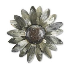 a metal sunflower wall decoration on a white background with an oval design in the center