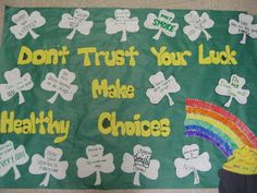 a green bulletin board with shamrocks and words that say don't trust your luck make healthy choices