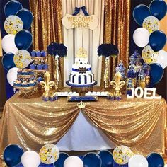 a blue and gold themed dessert table