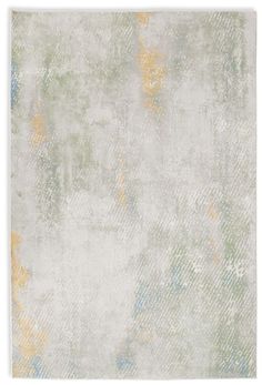 a white rug with yellow, blue and green colors on the bottom half of it