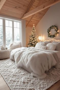 a bedroom decorated for christmas with white furs and lights on the windowsill, along with a large bed