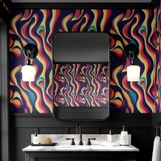 a colorful bathroom with two sinks and a large mirror on the wall above it,