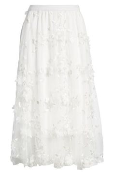 This endlessly enchanting maxi skirt is crafted from luscious chiffon and accented with wispy tulle blooms. Lined 90% polyester, 10% spandex Dry clean Made in the USA Elegant White Floor-length Maxi Skirt, Elegant Spring Tulle Maxi Skirt, Elegant Floral Skirt For Spring, Elegant Floral Embellished Skirt For Spring, Elegant Tulle Maxi Skirt For Party, Chic Floor-length Maxi Skirt For Wedding, Elegant Flowy Tulle Skirt, Spring Wedding Feminine Maxi Skirt, Chic Flowy Tulle Maxi Skirt